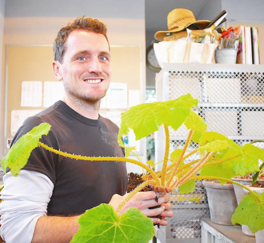 Ryan McCallister holding a begonia.