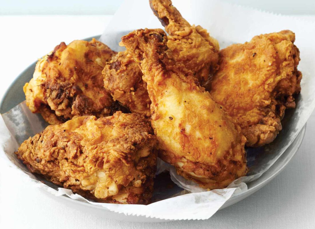 bowl of fried chicken on a white linen