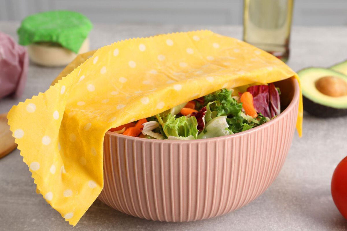 Bowl of salad covered with beeswax food wrap