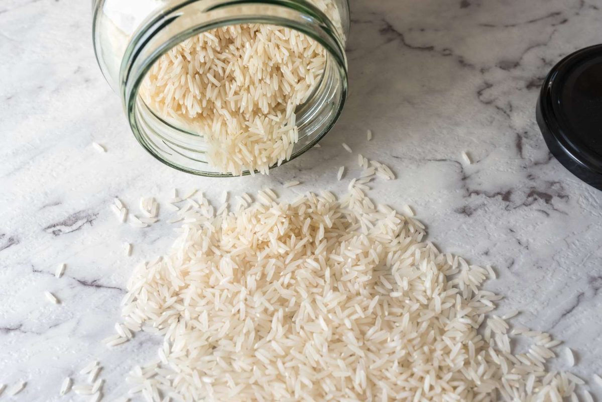 white rice in jar and on counter