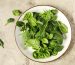 baby spinach on white plate
