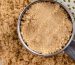 light brown sugar in a measuring cup and on a surface