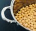 Gold raw chickpea beans closeup, tasty protein nutrition for vegans, natural food ingredients