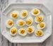 deviled eggs with relish on white platter